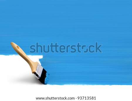 Paint brush painting vertical surface area blue on white background