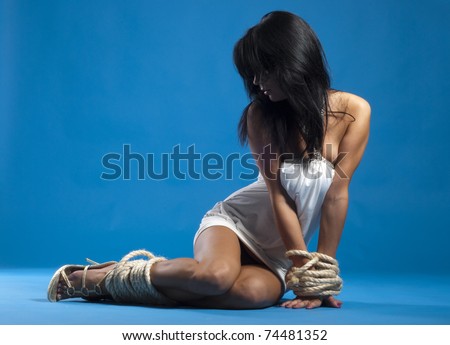 Sexy beautiful lady sitting on a floor