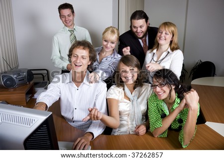 stock-photo-young-people-laughing-and-pointing-at-the-computer-screen-37262857.jpg