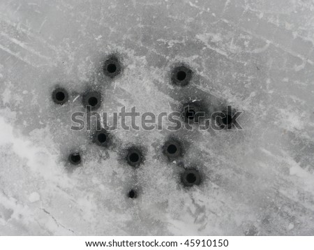 Man-hole cover texture covered in snow and ice