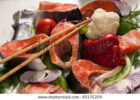 Stake of a salmon with vegetables on a plate
