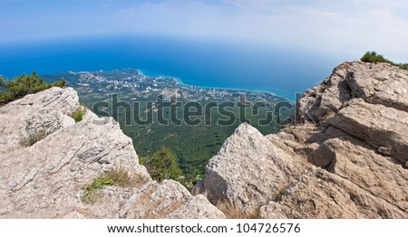 Summer view seacoast. Warm sea and beautiful nature. Yalta beach. Black Sea, Ukraine
