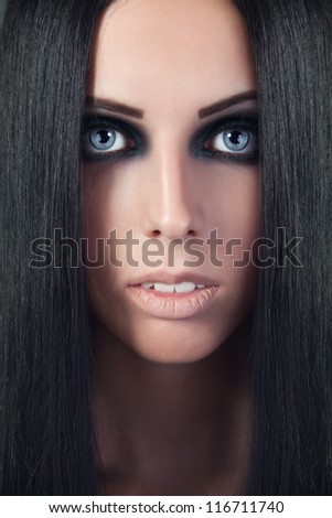 Beautiful woman. Fashion portrait. Close-up face makeup. Black hair young woman portrait, studio shot