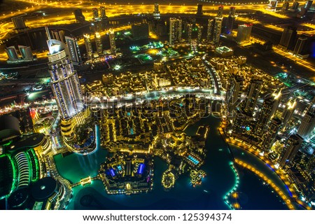 Dubai downtown night scene with city lights, luxury new high tech town in middle East, United Arab Emirates architecture