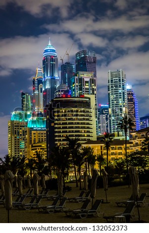 DUBAI, UAE - NOVEMBER 13: Dubai downtown night scene with city lights, luxury new high tech town in United Arab Emirates architecture on November 13, 2012 in Dubai, UAE. Dubai Marina cityscape, UAE