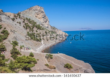 Summer view seacoast. Warm sea and beautiful nature. Sudak beach. Black Sea, Ukraine