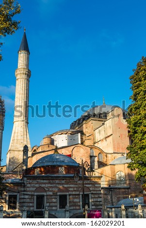 ISTANBUL - JUL 15: Visitors enjoying in front of Hagia Sophia Museum on July 15, 2013 in Istanbul, Turkey. Basilica is a world wonder of Istanbul since it was built in 537 AD. Hagia Sophia Park
