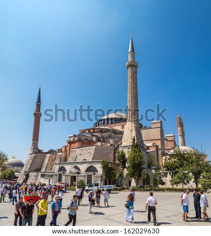 ISTANBUL - JUL 15: Visitors enjoying in front of Hagia Sophia Museum on July 15, 2013 in Istanbul, Turkey. Basilica is a world wonder of Istanbul since it was built in 537 AD. Hagia Sophia Park