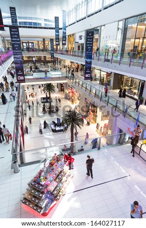 DUBAI, UAE - NOVEMBER 14: Shoppers at Dubai Mall on November 14, 2012 in Dubai. At over 12 million sq ft, it is the world\'s largest shopping mall