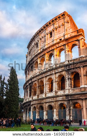 ROME -OCTOBER 21: Coliseum exterior on October 21, 2012 in Rome, Italy. The Coliseum is one of Rome\'s most popular tourist attractions with over 5 million visitors per year.