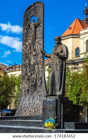 monument to poet Taras Shevchenko, church of Saint Peter and Paul and tower of town hall  in Lvov, Ukraine. Monument has been erected in 1992.