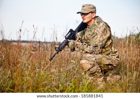 Soldier with a rifle in the field