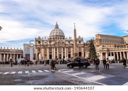 VATICAN CITY, VATICAN - DECEMBER 23: Tourists at Saint Peter\'s Square on December 23, 2013 in Vatican City, Vatican. Saint Peter\'s Square is among most popular pilgrimage sites for Roman Catholics.
