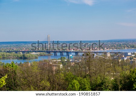 panorama of city landscape and nature. Kiev, Ukraine. Green trees, architecture, and blue river