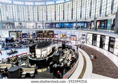 DUBAI, UAE - NOVEMBER 14: Shoppers at Dubai Mall on November 14, 2012 in Dubai. At over 12 million sq ft, it is the world\'s largest shopping mall