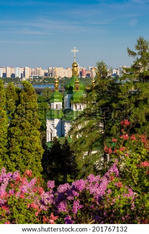 Panorama of the city of Kiev. Ukraine. View of the monastery Vydubitsky, left bank of the Dnieper River and the modern part of town. Kyiv.