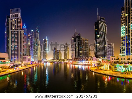 DUBAI, UAE - NOVEMBER 13: Dubai downtown night scene with city lights, luxury new high tech town in middle East. Dubai Marina cityscape, on November 13, 2012 in Dubai, UAE.
