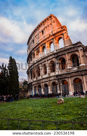 ROME -OCTOBER 21: Coliseum exterior on October 21, 2013 in Rome, Italy. The Coliseum is one of Rome\'s most popular tourist attractions with over 5 million visitors per year.