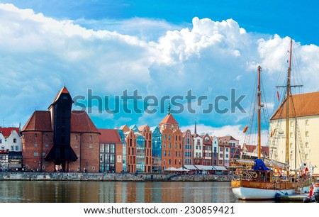 GDANSK, POLAND - JUNE 9: Tourist ship and colourful historic houses reflection Motlawa river in port of Gdansk on 9th June 2014, Baltic Sea, Poland.