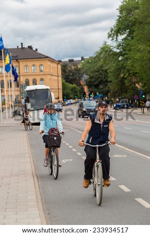 STOCKHOLM - SEPTEMBER 8: Bicyclists on street in Stockholm, Sweden on September 8, 2014. Bicycle is popular ecological transport and about 150 thousand people regularly use bicycles for transportation