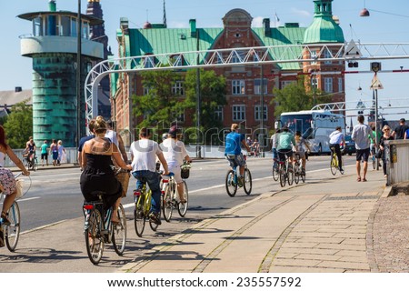 COPENHAGEN, DENMARK - JULY 25: Copenhagen is one of the most bicycle friendly cities in the World. Many people biking in centre of city in Copenhagen, Denmark July 25, 2014