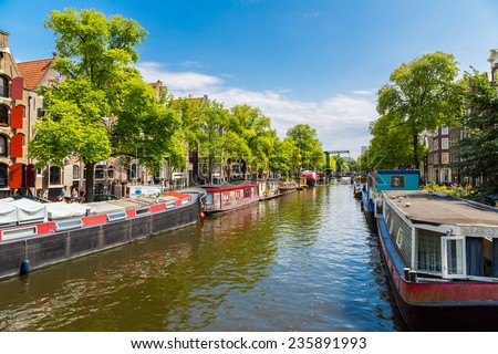 AMSTERDAM, NETHERLANDS - AUGUST 19: Canals of Amsterdam. Amsterdam is the capital and most populous city of the Netherlands on August 19, 2014