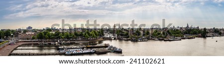 AMSTERDAM, NETHERLANDS - AUGUST 19: Canal and bridge in Amsterdam. Amsterdam is the capital and most populous city of the Netherlands on August 19, 2014