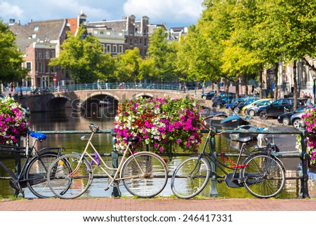 Bicycles on a bridge over the canals of Amsterdam. Amsterdam is the capital and most populous city of the Netherlands