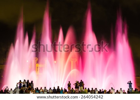 Magic Fountain light show at night next to National museum in Barcelona, Spain