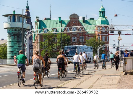 COPENHAGEN, DENMARK - JULY 25: Copenhagen is one of the most bicycle friendly cities in the World. Many people biking in centre of city in Copenhagen, Denmark July 25, 2014