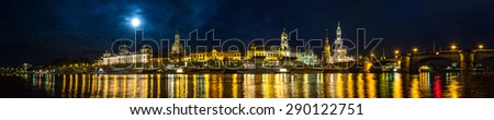 Panoramic view of Dresden in night and the river Elbe.