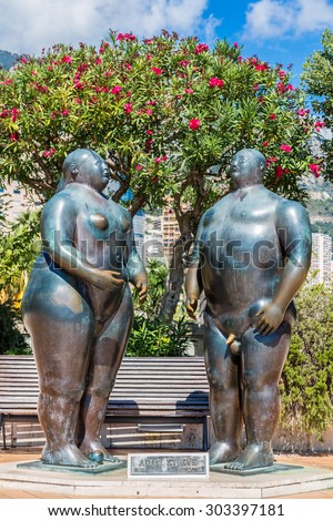 MONTE CARLO - JULY 17: Sculpture of Adam and Eve by Fernando Botero in garden Monte Carlo in Monaco in a summer day on July 17, 2014