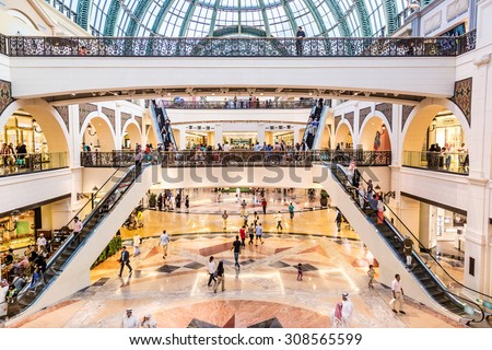 DUBAI, UAE - APRIL 29: Shoppers at Mall of the Emirates on April 29, 2013 in Dubai. Mall of the Emirates is a shopping mall in the Al Barsha district of Dubai.