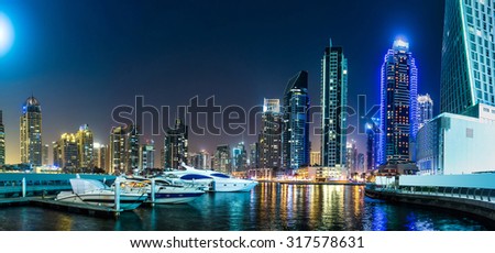 Dubai downtown night scene with city lights, luxury new high tech town in middle East. Dubai Marina cityscape, UAE.