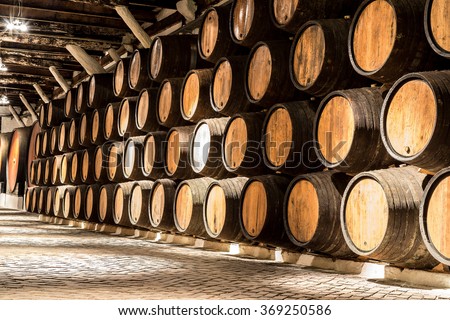 Barrels in the wine cellar in Porto in Portugal