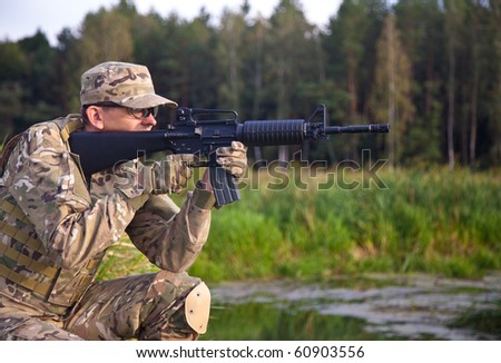 Soldier with a rifle in the field