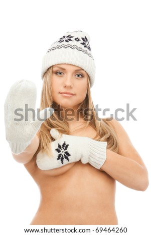 stock photo Young blond naked woman in knit mittens and cap