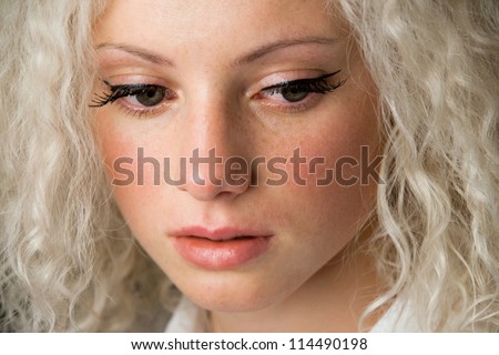 Crying woman, beautiful face with tear drops, facial expression, pain and grief concept