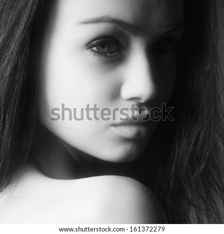 black and white portrait of young beautiful female