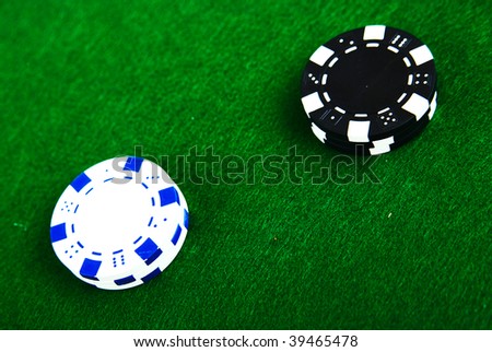 Casino chips on green felt