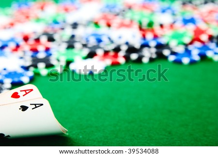 Two aces and big stake on green felt