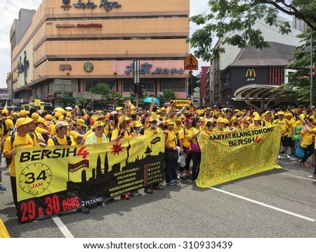 Kuala Lumpur, Malayia 29 August 2015 : Yellow shirt Supporters display banner and signature campaign Bersih Rally for Free Fair Elections. Bersih organized Rallies 29/30 Aug in cities around Malaysia