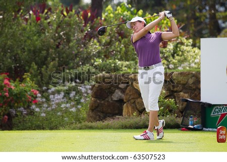 KUALA LUMPUR, MALAYSIA - OCTOBER 22: Scottish Catriona Matthew finishes teeing off on hole 2 on Day 1 of the Sime Darby LPGA Golf Tournament on October 22, 2010 in Kuala Lumpur, Malaysia