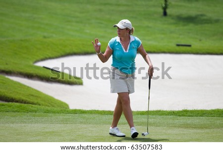 KUALA LUMPUR, MALAYSIA - OCTOBER 22: American Christie Kerr gestures after sinking her putt on Day 1 Sime Darby LPGA Golf October 22, 2010 in Kuala Lumpur, Malaysia.