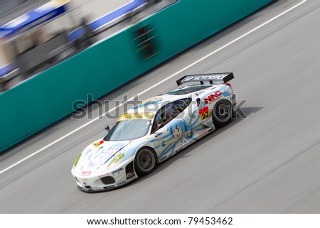 SEPANG, MALAYSIA - JUNE 18: Team LMP Motorsports in their Ferrari f430 going past the pit lane during qualifying at Super GT International series June 18, 2011 in Sepang, Malaysia