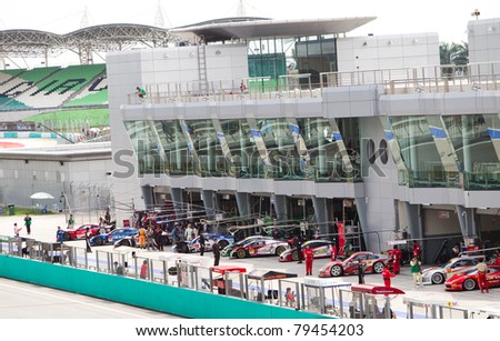 SEPANG, MALAYSIA - JUNE 18: SuperGT cars line up to start qualifying at the Super GT International series June 18, 2011 in Sepang, Malaysia