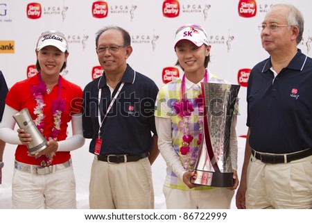 KUALA LUMPUR, MALAYSIA - OCTOBER 16: Champion Na Yeon Choi in a group photo after prize giving with Malaysian Prime Minister Najib at Sime Darby LPGA Golf October 16, 2011 in Kuala Lumpur, Malaysia.