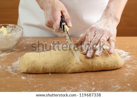 Making Pastry Dough for Hungarian Cake. Series. A baker cutting dough.
