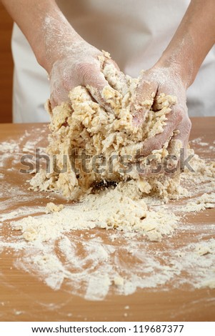 Making Pastry Dough for Hungarian Cake. Series. A baker kneading dough.