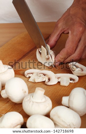 Cooking Mushrooms. Cutting.